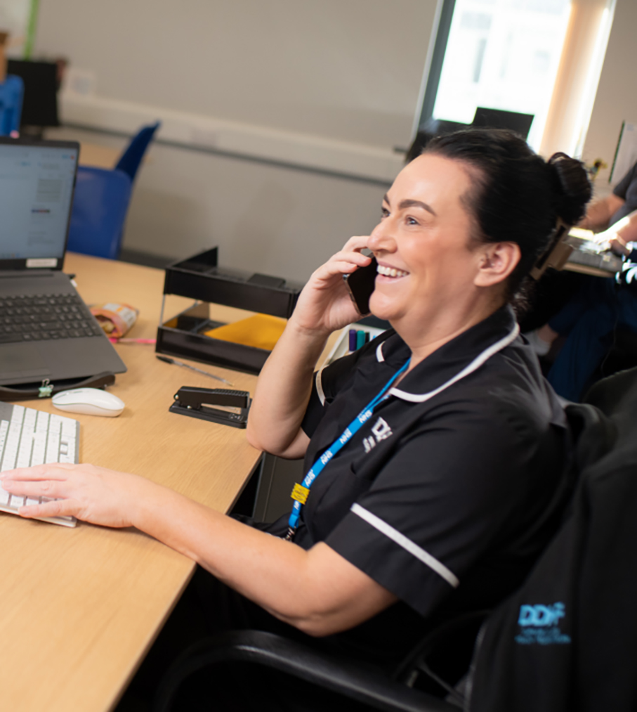 Support staff assisting a patient
