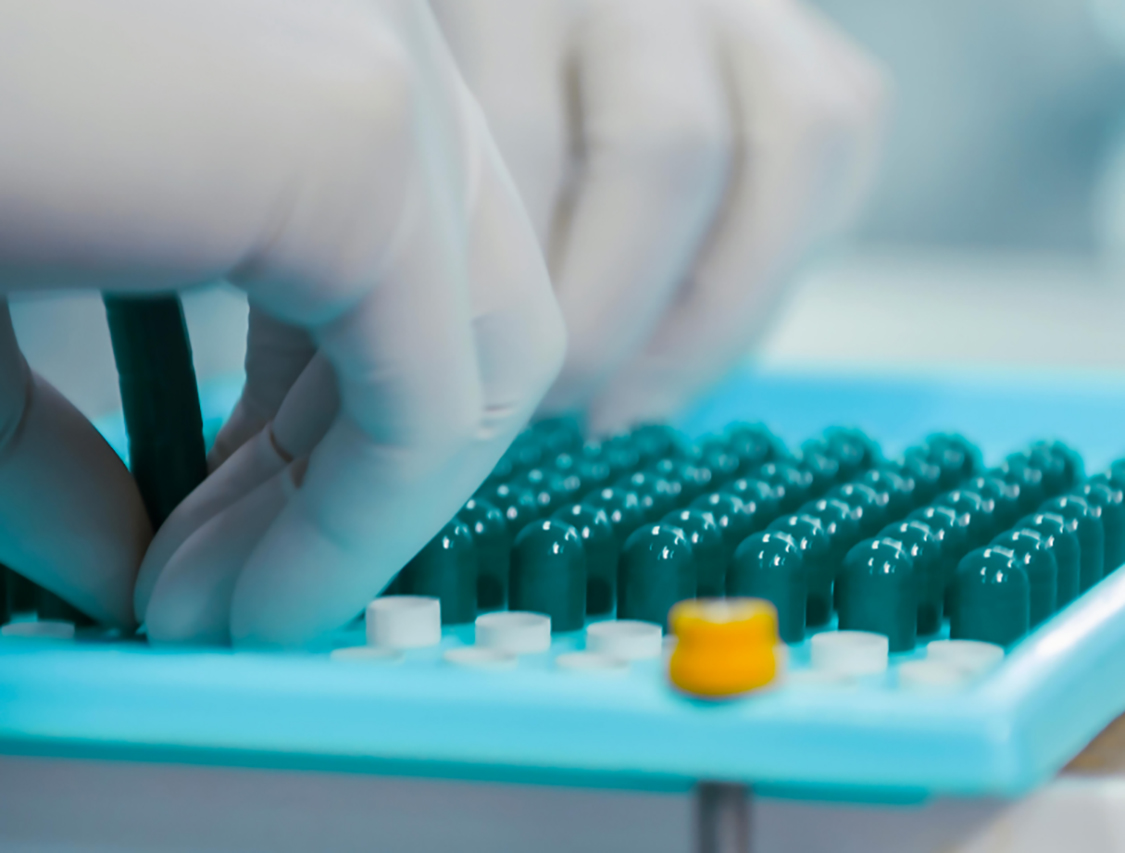 pharmacy professional preparing medication